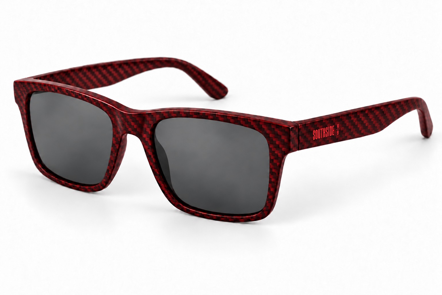 Red Tide sunglasses with a red-tinted carbon weave, smoke lenses, and a small red SOUTHSIDE HB temple logo.